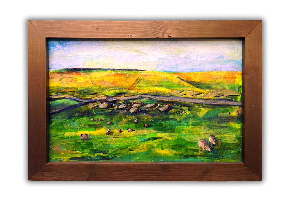 A framed work of art featuring sheep in a field